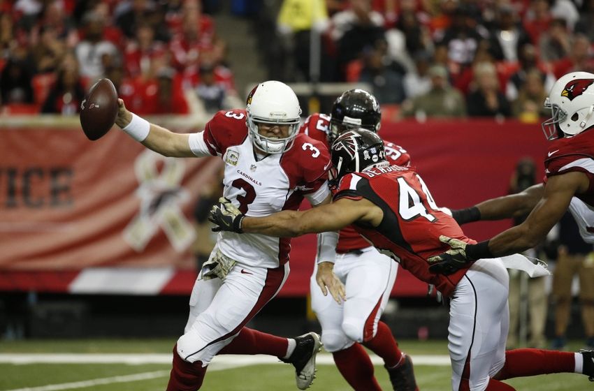 Nov 27, 2016; Atlanta, GA, USA; Arizona Cardinals quarterback Carson Palmer (3) is pressured by Atlanta Falcons outside linebacker Vic Beasley (44) in the second quarter of their game at the Georgia Dome. Mandatory Credit: Jason Getz-USA TODAY Sports