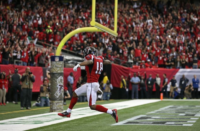 Nov 27, 2016; Atlanta, GA, USA; Atlanta Falcons wide receiver Taylor Gabriel (18) runs after a catch for a touchdown in the second quarter of their game against the Arizona Cardinals at the Georgia Dome. Mandatory Credit: Jason Getz-USA TODAY Sports