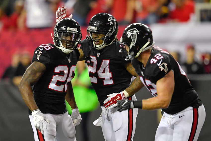Dec 18, 2016; Atlanta, GA, USA; Atlanta Falcons running back Devonta Freeman (24) reacts with Tevin Coleman (26) and Patrick DiMarco (42) after scoring a touchdown against the San Francisco 49ers during the second half at the Georgia Dome. The Falcons defeated the 49ers 41-13. Mandatory Credit: Dale Zanine-USA TODAY Sports