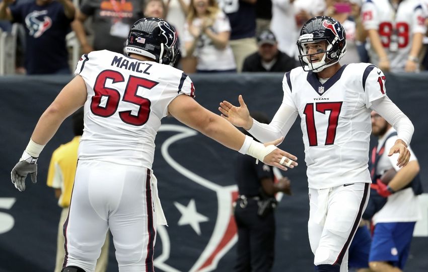 Sep 11, 2016; Houston, TX, USA; Houston Texans quarterback Brock Osweiler (17) celebrates with center Greg Mancz (65) after throwing a touchdown pass against the Chicago Bears during the first half at NRG Stadium. Mandatory Credit: Kevin Jairaj-USA TODAY Sports