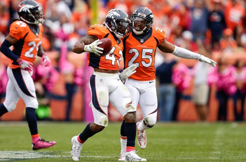 Oct 9, 2016; Denver, CO, USA; Denver Broncos strong safety T.J. Ward (43) celebrates his fumble recovery with cornerback Chris Harris Jr. (25) in the third quarter against the Atlanta Falcons at Sports Authority Field at Mile High. The Falcons won 23-16. Mandatory Credit: Isaiah J. Downing-USA TODAY Sports