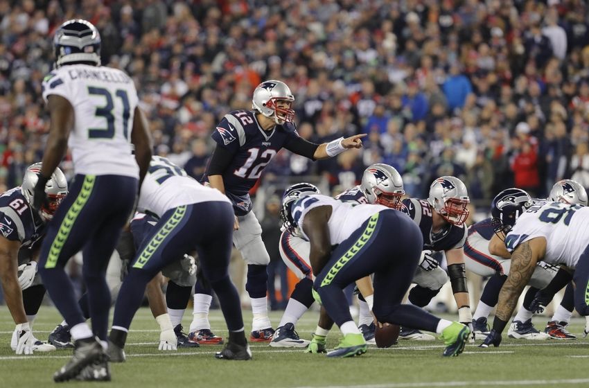 Nov 13, 2016; Foxborough, MA, USA; New England Patriots quarterback Tom Brady (12) at the line of scrimmage against the Seattle Seahawks in the first quarter at Gillette Stadium. Mandatory Credit: David Butler II-USA TODAY Sports