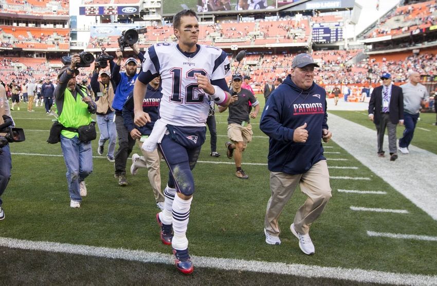 Oct 9, 2016; Cleveland, OH, USA; New England Patriots quarterback Tom Brady (12) runs off the field following the game against the Cleveland Browns at FirstEnergy Stadium. The Patriots won 33-13. Mandatory Credit: Scott R. Galvin-USA TODAY Sports