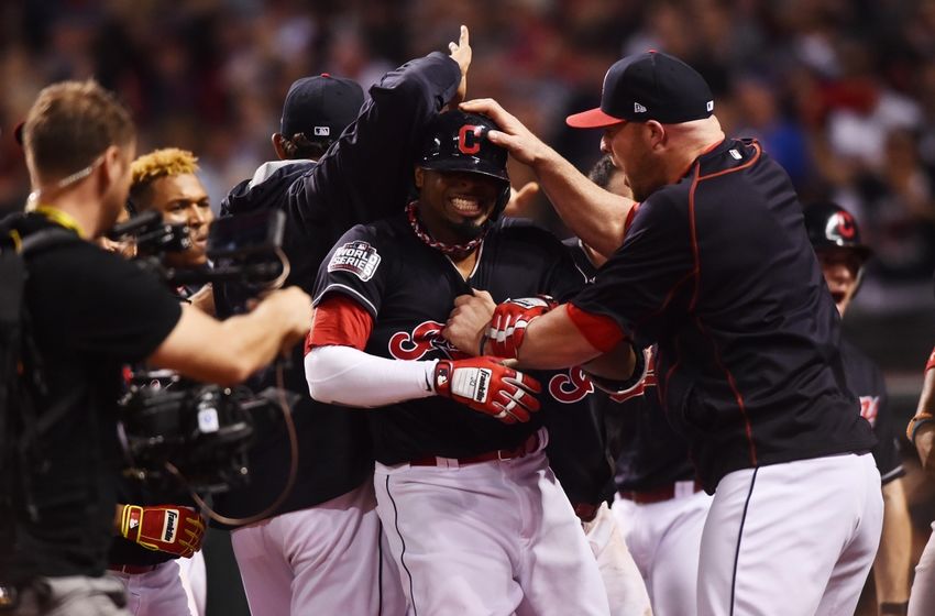 Nov 2, 2016; Cleveland, OH, USA; Cleveland Indians center fielder Rajai Davis (20) celebrates with teammates after hitting a two-run home run against the Chicago Cubs in the 8th inning in game seven of the 2016 World Series at Progressive Field. Mandatory Credit: Ken Blaze-USA TODAY Sports