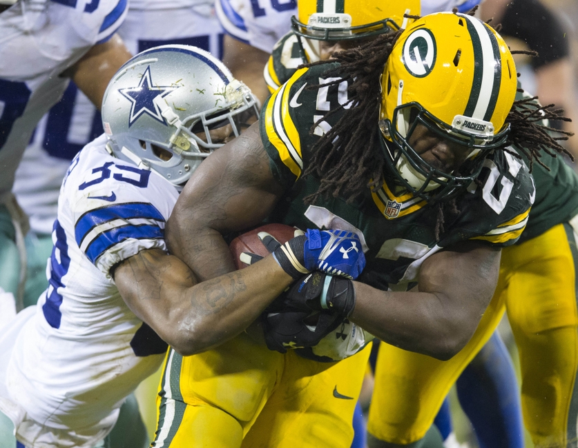 Dec 13, 2015; Green Bay, WI, USA; Green Bay Packers running back Eddie Lacy (27) is tackled by Dallas Cowboys cornerback Brandon Carr (39) during the fourth quarter at Lambeau Field. Green Bay won 28-7. Mandatory Credit: Jeff Hanisch-USA TODAY Sports