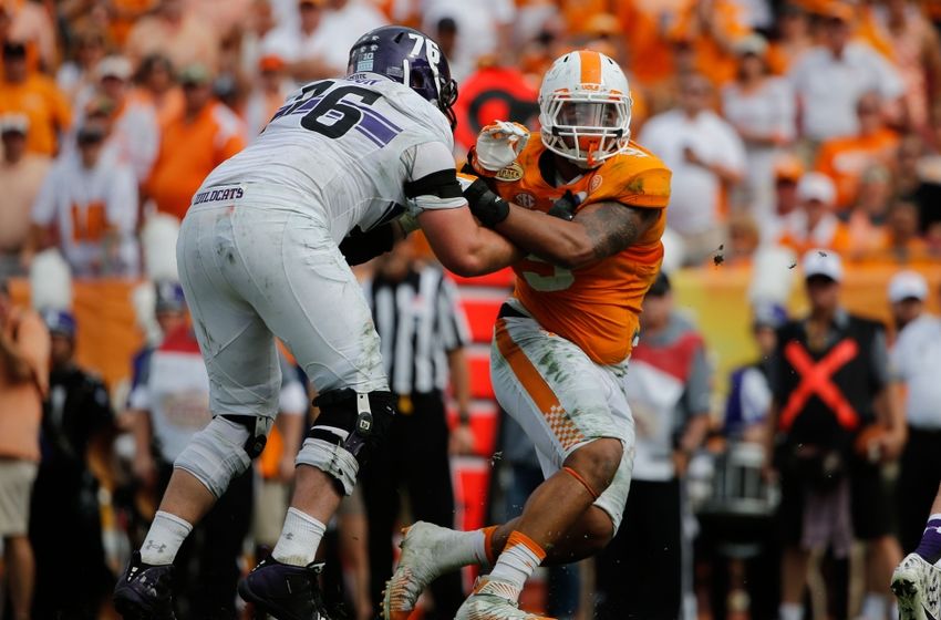 Tennessee Volunteers defensive end Derek Barnett (9) rushes past Northwestern Wildcats offensive lineman Eric Olson (76) during the first half in the 2016 Outback Bowl at Raymond James Stadium. Kim Klement-USA TODAY Sports