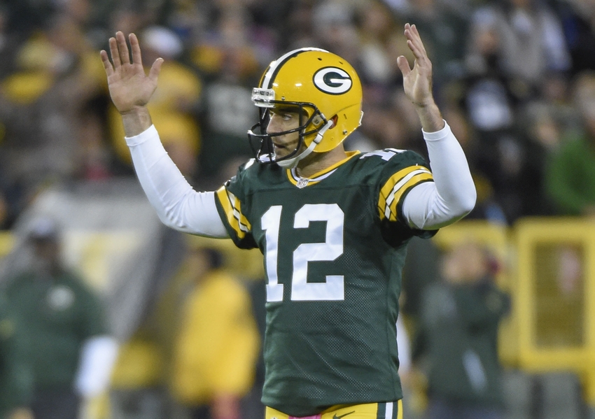 Green Bay Packers quarterback Aaron Rodgers reacts after throwing a touchdown pass to wide receiver Davante Adams (not pictured) in the second quarter during the game against the New York Giants at Lambeau Field. Benny Sieu-USA TODAY Sports