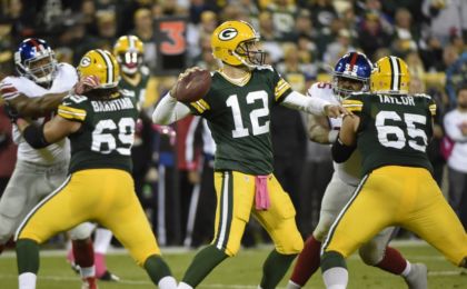 Oct 9, 2016; Green Bay, WI, USA; Green Bay Packers quarterback Aaron Rodgers (12) passes in the third quarter during the game against the New York Giants at Lambeau Field. Mandatory Credit: Benny Sieu-USA TODAY Sports