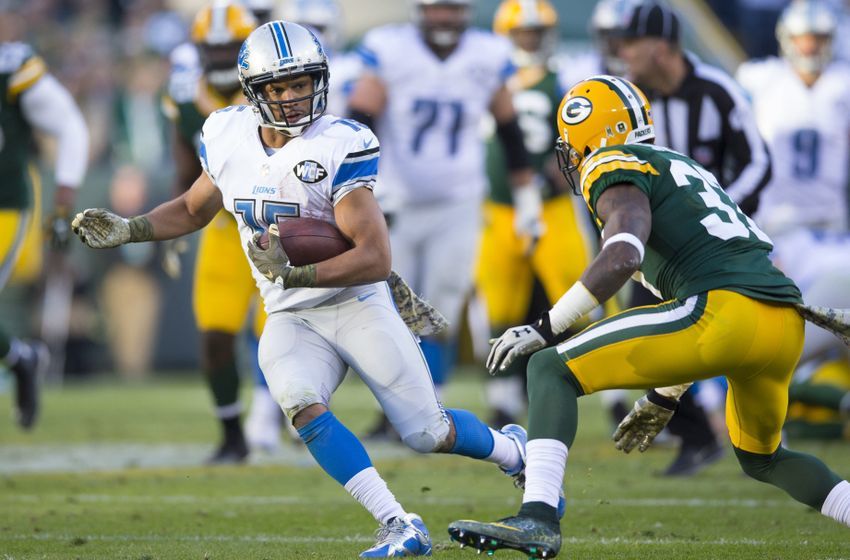 Nov 15, 2015; Green Bay, WI, USA; Detroit Lions wide receiver Golden Tate (15) rushes with the football after catching a pass during the fourth quarter against the Green Bay Packers at Lambeau Field. Detroit won 18-16. Mandatory Credit: Jeff Hanisch-USA TODAY Sports