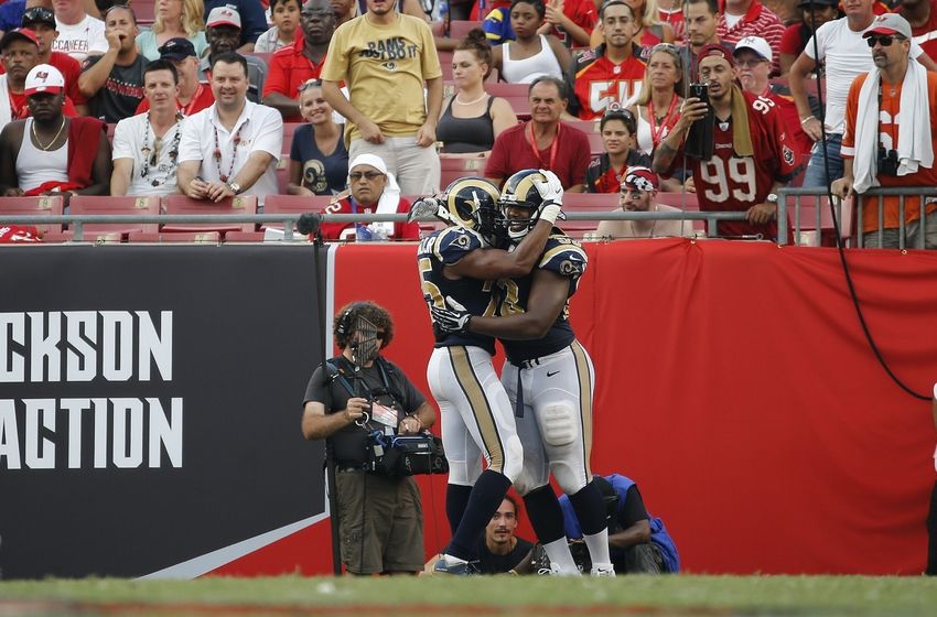 Sep 25, 2016; Tampa, FL, USA; Los Angeles Rams defensive tackle Ethan Westbrooks (93) is congratulated by strong safety T.J. McDonald (25) after he scored a touchdown against the Tampa Bay Buccaneers during the second half at Raymond James Stadium. Mandatory Credit: Kim Klement-USA TODAY Sports
