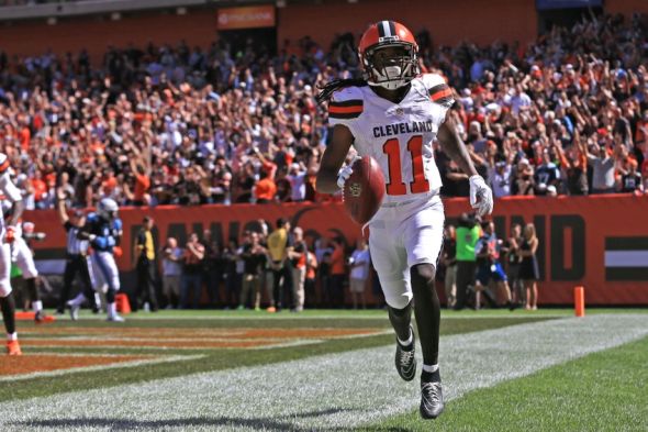 Sep 20, 2015; Cleveland, OH, USA; Cleveland Browns wide receiver Travis Benjamin (11) returns for a punt for a touchdown during the second quarter against the Tennessee Titans at FirstEnergy Stadium. Mandatory Credit: Andrew Weber-USA TODAY Sports