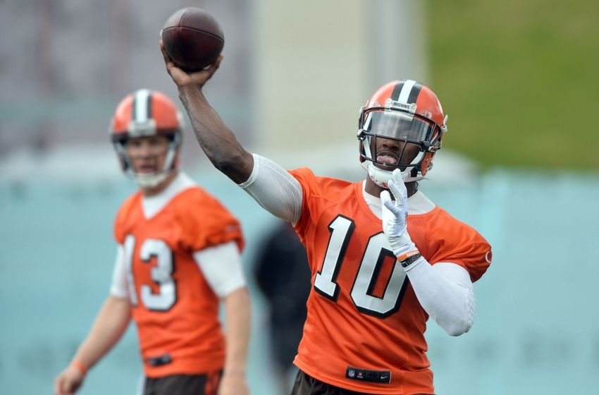Jun 7, 2016; Berea, OH, USA; Cleveland Browns quarterback Robert Griffin III (10) throws a pass as quarterback Josh McCown (13) watches during minicamp at the Cleveland Browns training facility. Mandatory Credit: Ken Blaze-USA TODAY Sports