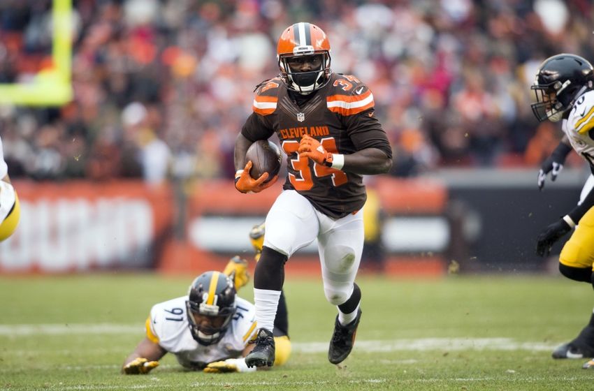 Jan 3, 2016; Cleveland, OH, USA; Cleveland Browns running back Isaiah Crowell (34) runs past a tackle fromPittsburgh Steelers defensive end Stephon Tuitt (91) during the first quarter at FirstEnergy Stadium. The Steelers defeated the Browns 28-12. Mandatory Credit: Scott R. Galvin-USA TODAY Sports