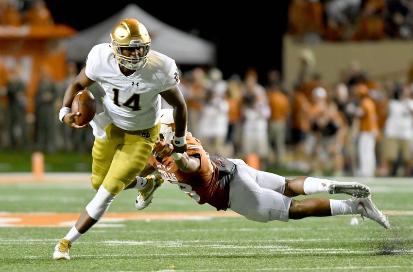 Sep 4, 2016; Austin, TX, USA; Notre Dame Fighting Irish quarterback DeShone Kizer (14) runs for a touchdown as Texas Longhorns safety Kevin Vaccaro (18) defends in the third quarter at Darrell K. Royal-Texas Memorial Stadium. Texas won 50-47 in double overtime. Mandatory Credit: Matt Cashore-USA TODAY Sports