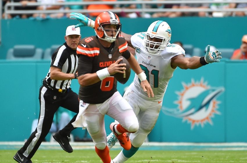 Sep 25, 2016; Miami Gardens, FL, USA; Cleveland Browns quarterback Cody Kessler (6) scrambles under pressure from Miami Dolphins defensive end Cameron Wake (91) during the first half at Hard Rock Stadium. Mandatory Credit: Jasen Vinlove-USA TODAY Sports
