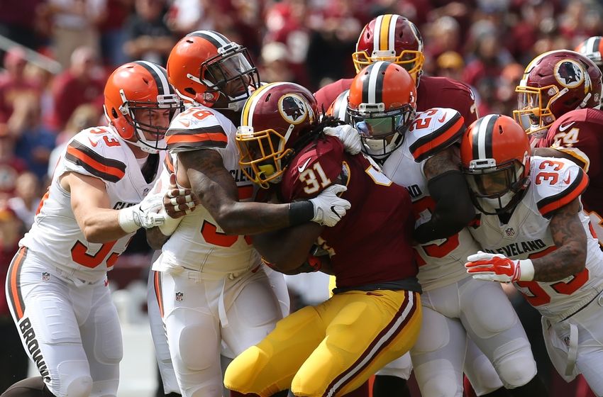 Oct 2, 2016; Landover, MD, USA; Washington Redskins running back Matt Jones (31) carries the ball as Cleveland Browns linebacker Christian Kirksey (58) and Browns defensive back Joe Haden (23) make the tackle in the first quarter at FedEx Field. Mandatory Credit: Geoff Burke-USA TODAY Sports