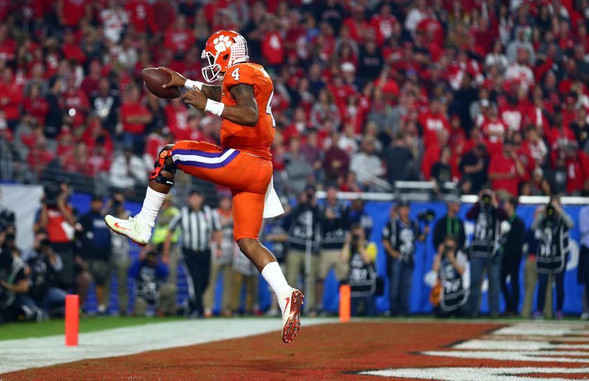 December 31, 2016; Glendale, AZ, USA; Clemson Tigers quarterback Deshaun Watson (4) runs the ball in for a touchdown against the Ohio State Buckeyes during the second half of the the 2016 CFP semifinal at University of Phoenix Stadium. Mandatory Credit: Mark J. Rebilas-USA TODAY Sports