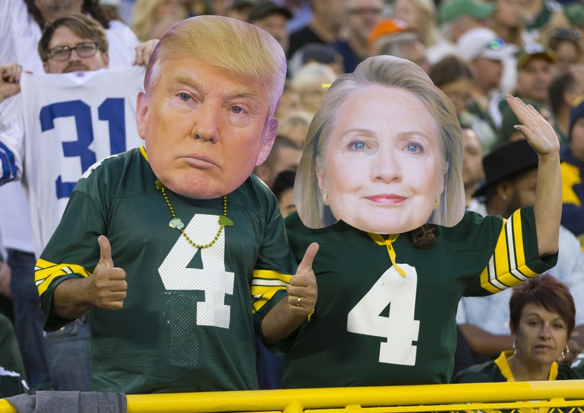 Oct 16, 2016; Green Bay, WI, USA; Green Bay Packers fans wear masks of Donald Trump and Hillary Clinton during the fourth quarter against the Dallas Cowboys at Lambeau Field. The Cowboys won 30-16. Mandatory Credit: Jeff Hanisch-USA TODAY Sports