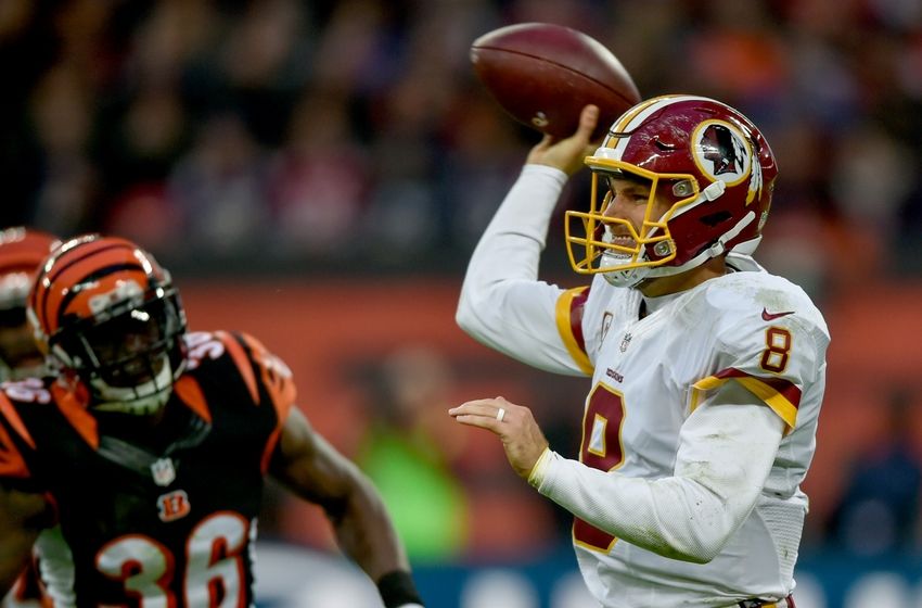 Oct 30, 2016; London, United Kingdom; Washington Redskins quarterback Kirk Cousins (8) looks down field under pressure from Cincinnati Bengals safety Shawn Williams (36) during the second half at Wembley Stadium. Mandatory Credit: Steve Flynn-USA TODAY Sports