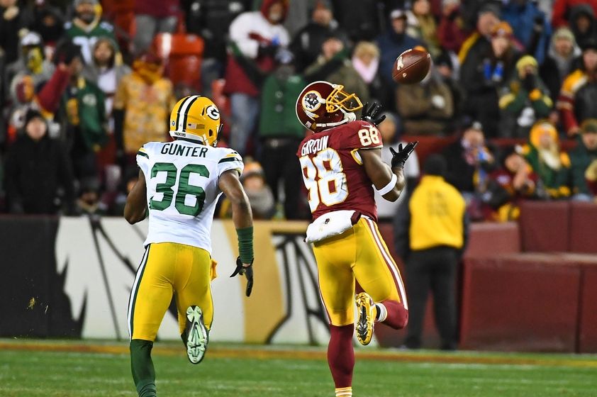 Nov 20, 2016; Landover, MD, USA; Washington Redskins wide receiver Pierre Garcon (88) catches a 70 yard touchdown pass as Green Bay Packers cornerback LaDarius Gunter (36) chases during the second half at FedEx Field. Mandatory Credit: Brad Mills-USA TODAY Sports