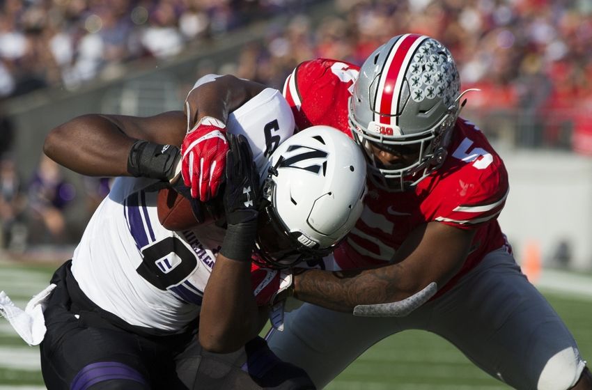 Oct 29, 2016; Columbus, OH, USA; Northwestern Wildcats fullback Garrett Dickerson (9) is tackled by Ohio State Buckeyes linebacker Raekwon McMillan (5) at Ohio Stadium. Mandatory Credit: Greg Bartram-USA TODAY Sports