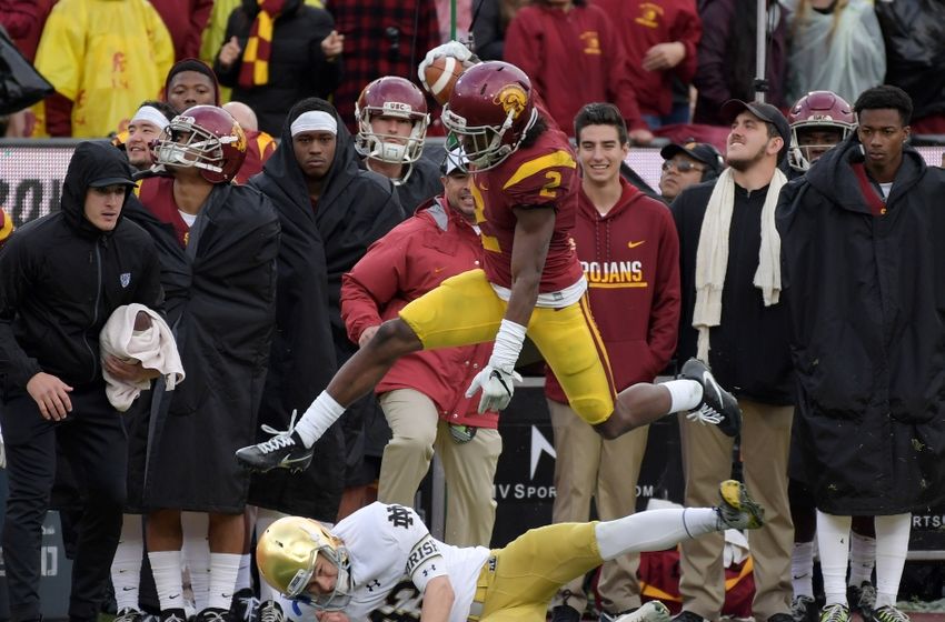 Nov 26, 2016; Los Angeles, CA, USA; Southern California Trojans defensive back Adoree Jackson (2) hurdles Notre Dame Fighting Irish place kicker John Chereson (43) on a 97-yard touchdown kickoff return in the third quarter during a NCAA football game against the Notre Dame Fighting Irish at Los Angeles Memorial Coliseum. Mandatory Credit: Kirby Lee-USA TODAY Sports