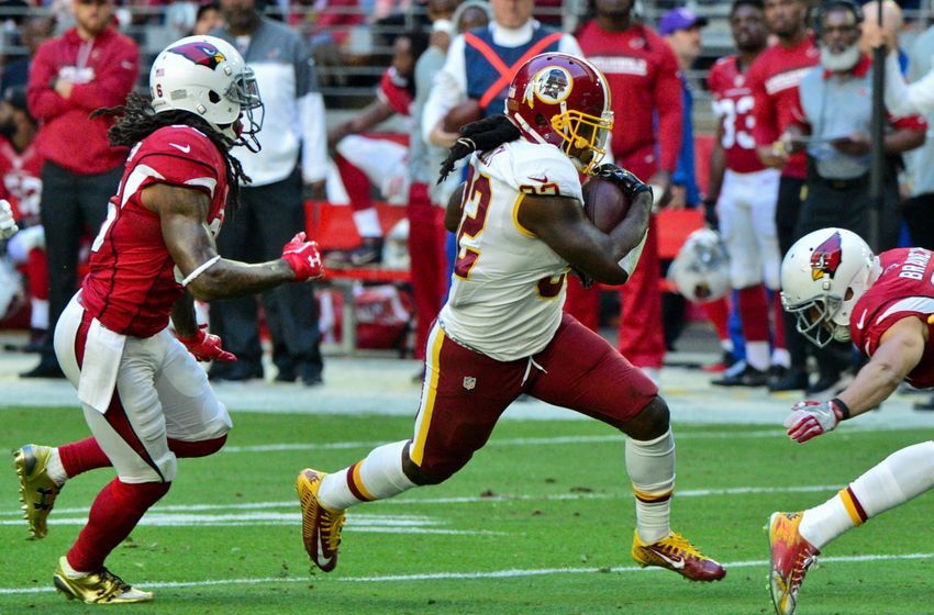 Dec 4, 2016; Glendale, AZ, USA; Washington Redskins running back Robert Kelley (32) carries the ball as Arizona Cardinals safety D.J. Swearinger (36) defends during the first half at University of Phoenix Stadium. Mandatory Credit: Matt Kartozian-USA TODAY Sports
