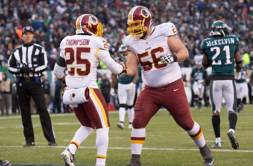 Dec 11, 2016; Philadelphia, PA, USA; Washington Redskins running back Chris Thompson (25) reacts with center John Sullivan (56) after his touchdown run against the Philadelphia Eagles during the fourth quarter at Lincoln Financial Field. The Washington Redskins won 27-22. Mandatory Credit: Bill Streicher-USA TODAY Sports