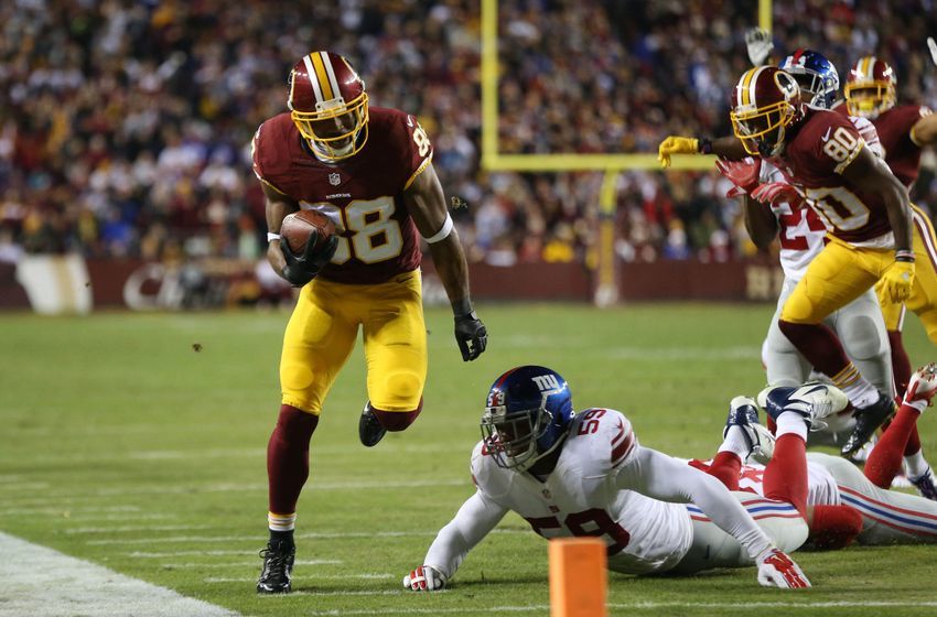 Jan 1, 2017; Landover, MD, USA; Washington Redskins wide receiver Pierre Garcon (88) runs with the ball as New York Giants linebacker Devon Kennard (59) attempts the tackle in the fourth quarter at FedEx Field. The Giants won 19-10. Mandatory Credit: Geoff Burke-USA TODAY Sports