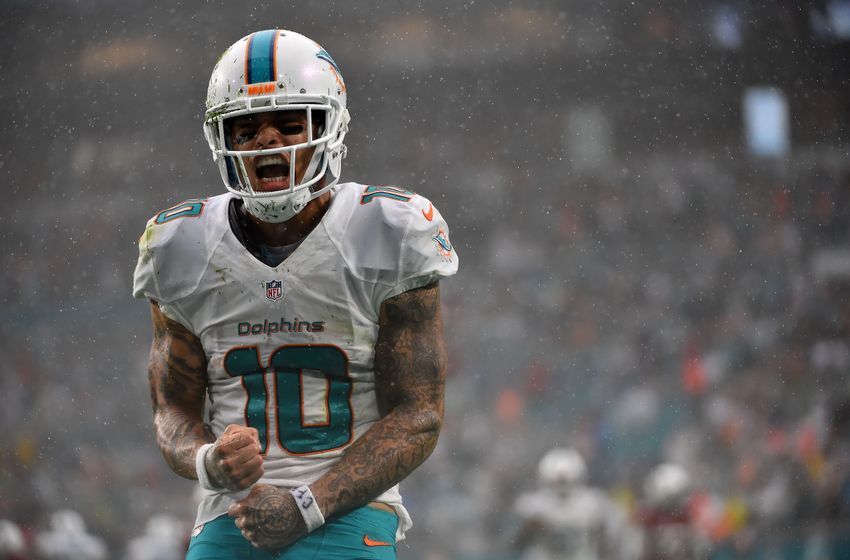 Dec 11, 2016; Miami Gardens, FL, USA; Miami Dolphins wide receiver Kenny Stills (10) celebrates after making a catch in the game against the Arizona Cardinals during the second half at Hard Rock Stadium. The Miami Dolphins defeat the Arizona Cardinals 26-23. Mandatory Credit: Jasen Vinlove-USA TODAY Sports
