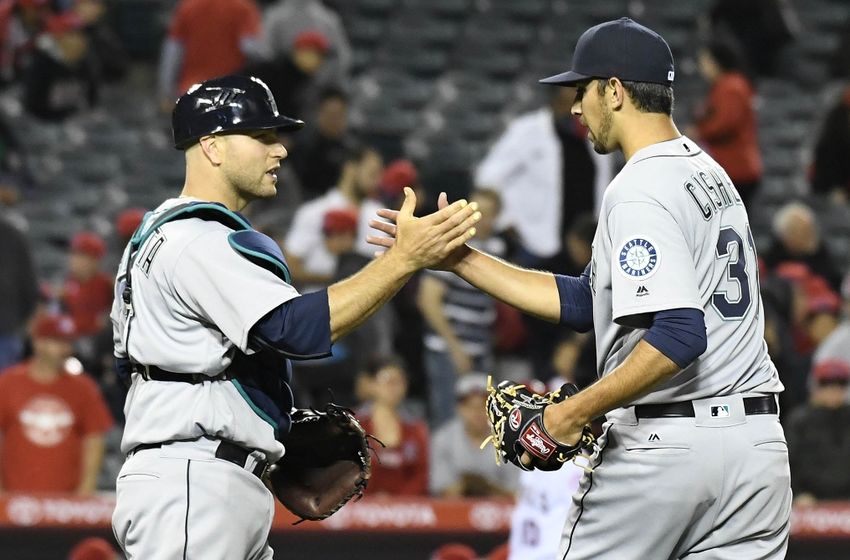 April 22, 2016; Anaheim, CA, USA; Seattle Mariners relief pitcher Steve Cishek (31) and catcher Chris Iannetta (33) celebrate the 5-2 victory against Los Angeles Angels at Angel Stadium of Anaheim. Mandatory Credit: Richard Mackson-USA TODAY Sports