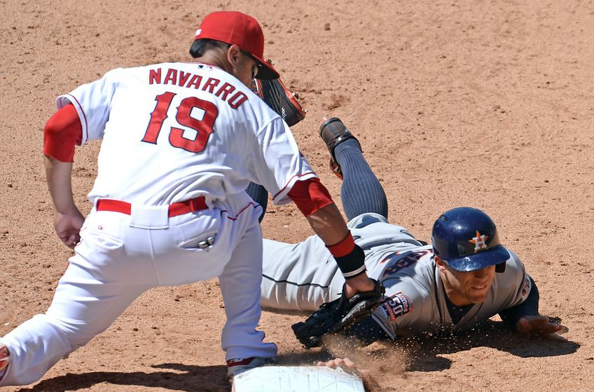 Jun 24, 2015; Anaheim, CA, USA; Los Angeles Angels left fielder Efren Navarro (19) makes the tag as Houston Astros right fielder George Springer (4) is picked off at first base in the eighth inning of the game at Angel Stadium of Anaheim. Angels won 2-1. Mandatory Credit: Jayne Kamin-Oncea-USA TODAY Sports