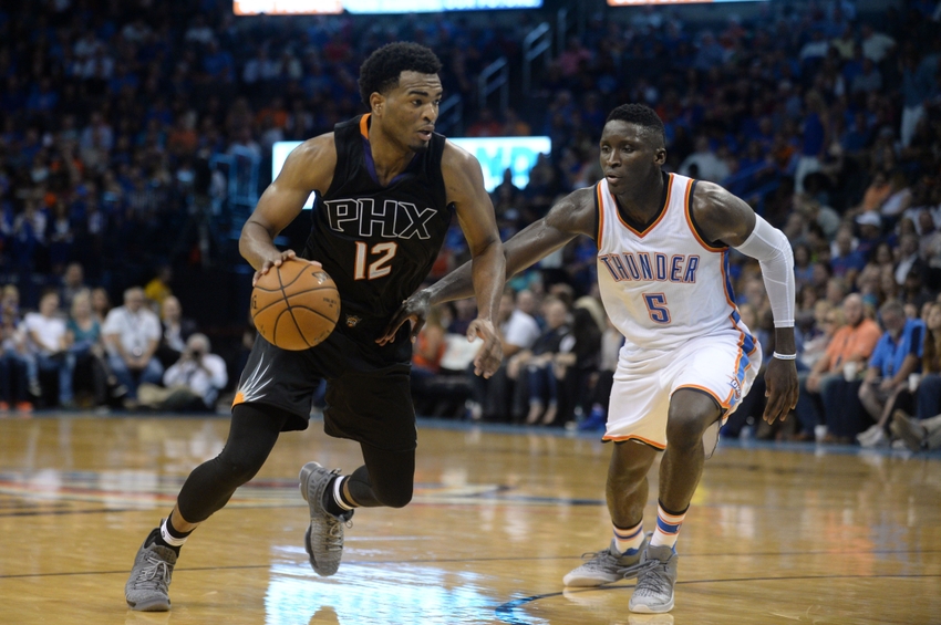 Oct 28, 2016; Oklahoma City, OK, USA; Phoenix Suns forward T.J. Warren (12) drives to the basket in front of Oklahoma City Thunder guard Victor Oladipo (5) during the fourth quarter at Chesapeake Energy Arena. Mandatory Credit: Mark D. Smith-USA TODAY Sports