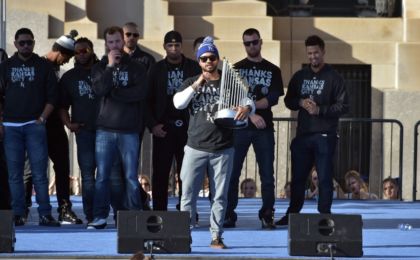 Nov 3, 2015; Kansas City, MO, USA; Kansas City Royals designated hitter Christian Colon speaks to fans while holding the Commissioners Trophy during the World Series victory celebration on stage at Union Station. Mandatory Credit: Denny Medley-USA TODAY Sports