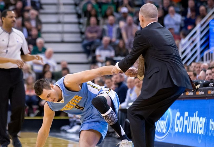 Feb 3, 2016; Salt Lake City, UT, USA; Denver Nuggets head coach Michael Malone helps forward Danilo Gallinari (8) up from the court during the first half against the Utah Jazz at Vivint Smart Home Arena. Mandatory Credit: Russ Isabella-USA TODAY Sports