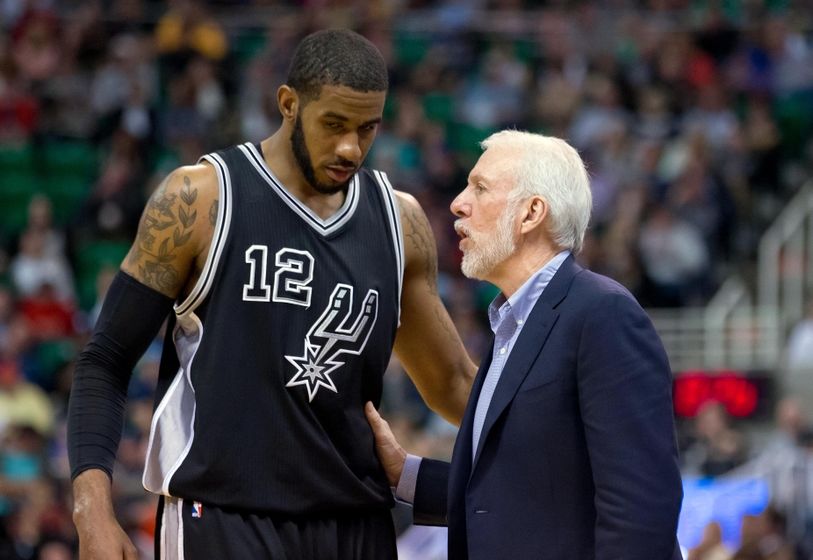 Apr 5, 2016; Salt Lake City, UT, USA; San Antonio Spurs head coach Gregg Popovich talks with forward LaMarcus Aldridge (12) during the second half against the Utah Jazz at Vivint Smart Home Arena. San Antonio won 88-86. Mandatory Credit: Russ Isabella-USA TODAY Sports