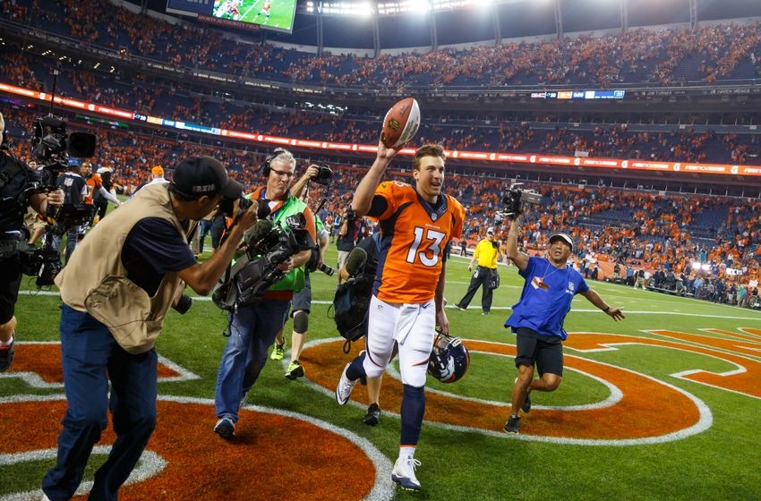 Sep 8, 2016; Denver, CO, USA; Denver Broncos quarterback Trevor Siemian (13) celebrates following the game against the Carolina Panthers at Sports Authority Field at Mile High. The Broncos defeated the Panthers 21-20. Mandatory Credit: Mark J. Rebilas-USA TODAY Sports