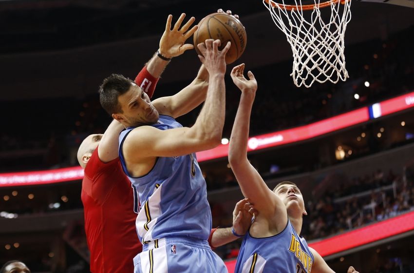 Jan 28, 2016; Washington, DC, USA; Denver Nuggets forward Danilo Gallinari (8) grabs a rebound in front of Washington Wizards center Marcin Gortat (13) in the third quarter at Verizon Center. The Nuggets won 117-113. Mandatory Credit: Geoff Burke-USA TODAY Sports