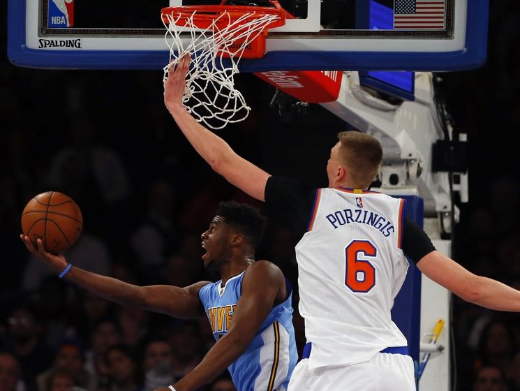 Feb 7, 2016; New York, NY, USA; Denver Nuggets guard Jameer Nelson (1) scores against New York Knicks forward Kristaps Porzingis (6) during second half at Madison Square Garden. The Denver Nuggets defeated the New York Knicks 101-96. Mandatory Credit: Noah K. Murray-USA TODAY Sports