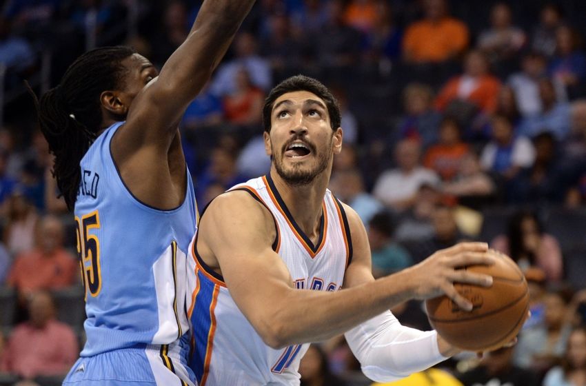 Oct 18, 2016; Oklahoma City, OK, USA; Oklahoma City Thunder center Enes Kanter (11) drives to the basket in front of Denver Nuggets forward Kenneth Faried (35) during the third quarter at Chesapeake Energy Arena. Mandatory Credit: Mark D. Smith-USA TODAY Sports