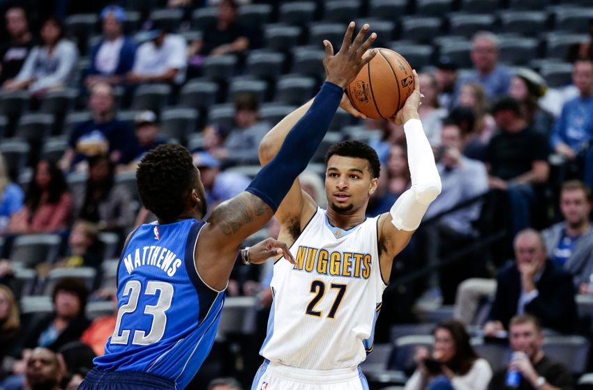 Oct 21, 2016; Denver, CO, USA; Dallas Mavericks guard Wesley Matthews (23) defends against Denver Nuggets guard Jamal Murray (27) in the first quarter at the Pepsi Center. Mandatory Credit: Isaiah J. Downing-USA TODAY Sports