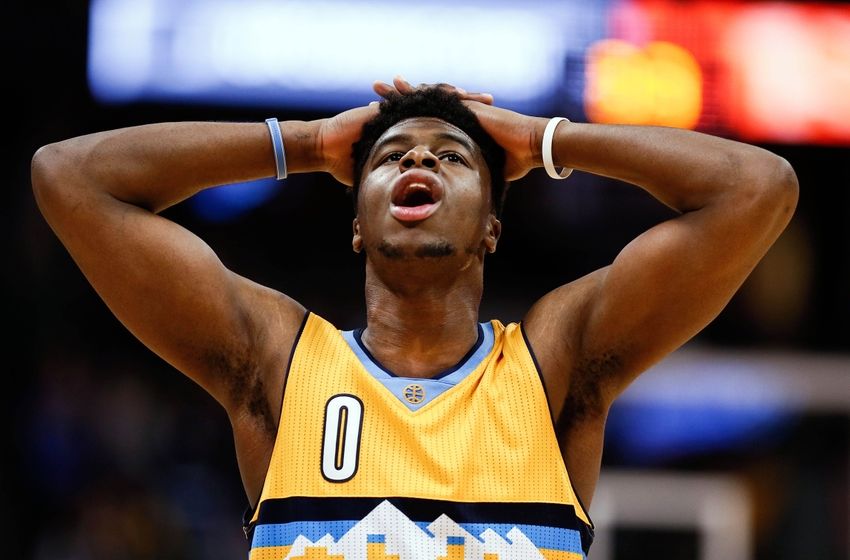 Mar 4, 2016; Denver, CO, USA; Denver Nuggets guard Emmanuel Mudiay (0) reacts after a play in the fourth quarter against the Brooklyn Nets at the Pepsi Center. The Nets defeated the Nuggets 121-120 in overtime. Mandatory Credit: Isaiah J. Downing-USA TODAY Sports