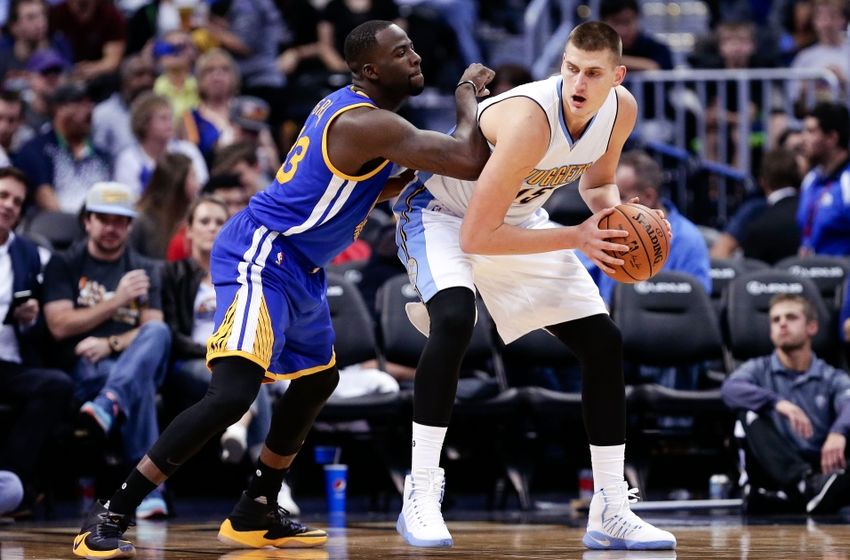 Oct 14, 2016; Denver, CO, USA; Golden State Warriors forward Draymond Green (23) defends Denver Nuggets center Nikola Jokic (15) in the third quarter at the Pepsi Center. The Warriors won 129-128. Mandatory Credit: Isaiah J. Downing-USA TODAY Sports