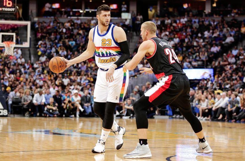 Oct 29, 2016; Denver, CO, USA; Denver Nuggets center Jusuf Nurkic (23) dribbles the ball as Portland Trail Blazers forward Mason Plumlee (24) defends in the first quarter at the Pepsi Center. Mandatory Credit: Isaiah J. Downing-USA TODAY Sports