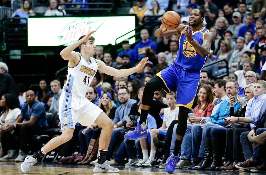 Nov 10, 2016; Denver, CO, USA; Golden State Warriors forward Kevin Durant (35) keeps the ball inbounds under pressure from Denver Nuggets forward Juancho Hernangomez (41) in the second quarter at the Pepsi Center. Mandatory Credit: Isaiah J. Downing-USA TODAY Sports