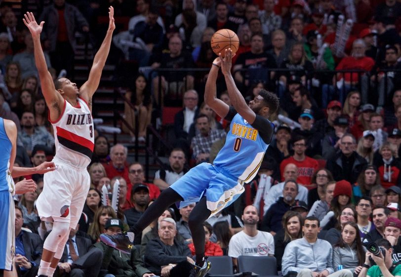 Nov 13, 2016; Portland, OR, USA; Denver Nuggets guard Emmanuel Mudiay (0) shoots over Portland Trail Blazers guard C.J. McCollum (3) during the fourth quarter at the Moda Center. Mandatory Credit: Craig Mitchelldyer-USA TODAY Sports