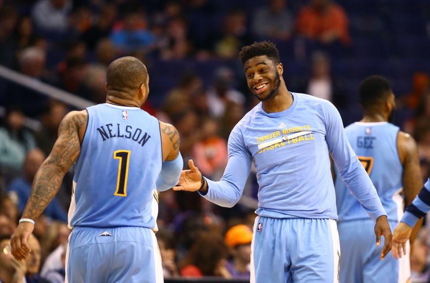 Nov 27, 2016; Phoenix, AZ, USA; Denver Nuggets guard Emmanuel Mudiay (right) celebrates a play with Jameer Nelson (1) in the second quarter against the Phoenix Suns at Talking Stick Resort Arena. Mandatory Credit: Mark J. Rebilas-USA TODAY Sports