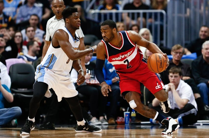 Mar 12, 2016; Denver, CO, USA; Denver Nuggets guard Emmanuel Mudiay (0) guards Washington Wizards guard John Wall (2) in the second quarter at the Pepsi Center. Mandatory Credit: Isaiah J. Downing-USA TODAY Sports