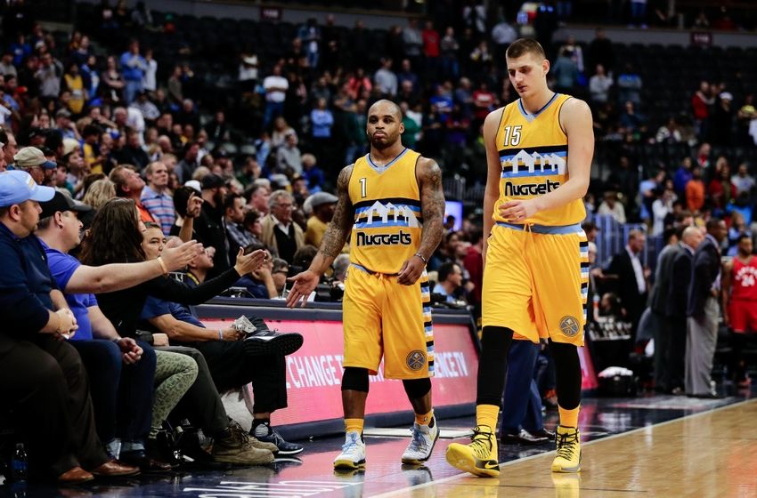 Nov 18, 2016; Denver, CO, USA; Denver Nuggets guard Jameer Nelson (1) and forward Nikola Jokic (15) come off the court in overtime against the Toronto Raptors at the Pepsi Center. The Raptors won 113-111 in overtime. Mandatory Credit: Isaiah J. Downing-USA TODAY Sports