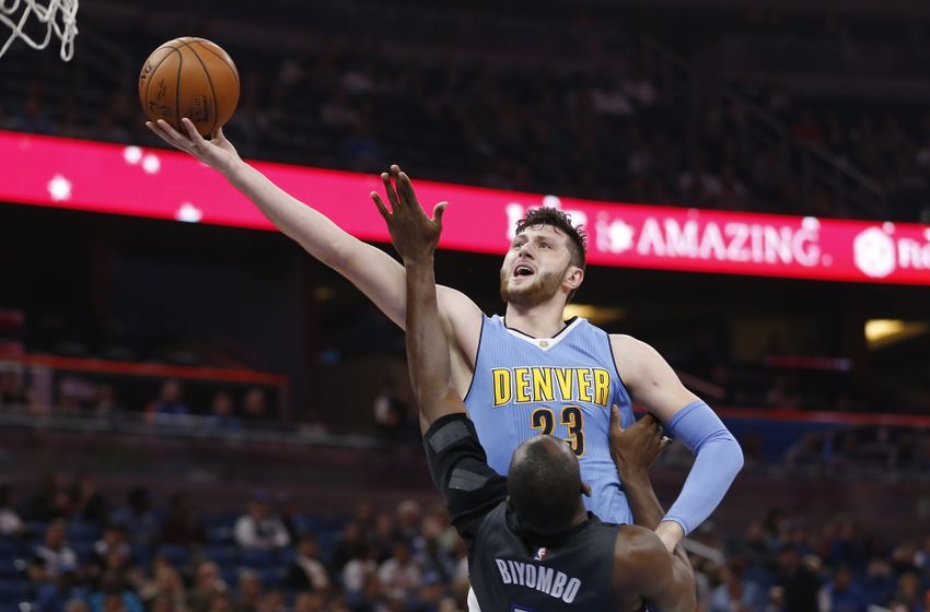 Dec 10, 2016; Orlando, FL, USA; Denver Nuggets center Jusuf Nurkic (23) shoots the ball over Orlando Magic center Bismack Biyombo (11) during the first quarter of an NBA basketball game at Amway Center. Mandatory Credit: Reinhold Matay-USA TODAY Sports